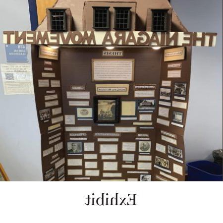 Labeled ‘Exhibit.’ Shows top half of a trifold exhibit board titled 'The Niagara Movement.' The top of the board looks like a roof of a building with windows, and below the title are boxes with text and b&w photos.